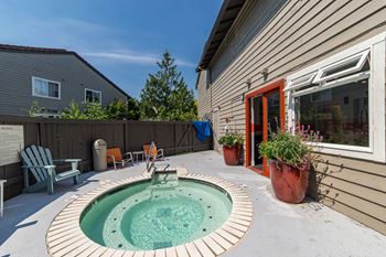 A small pool sits in the backyard of a house